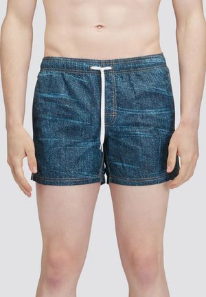 Costumi da bagno in denim blu con lacci bianchi, caratterizzati da una texture liscia e da cuciture dorate a contrasto. Lunghezza a metà coscia. Senza tasche.