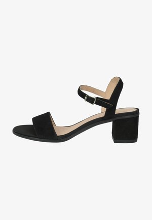 Black suede sandal with a wide toe strap, ankle strap featuring a silver buckle, and a low square block heel. Smooth interior lining.