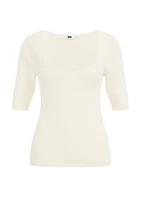 Ljusgräddfärgad ribbad stickad topp med fyrkantig halsringning och korta ärmar. Tyget har en slät textur och en figurnära design.