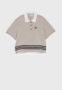 Béžová polokošile s bílým límečkem, třemi knoflíky na krku, černým logem Adidas a černými dvojitými pruhy na spodním lemu.