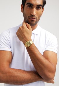 Nixon Uhr - gold-coloured