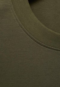 Olive green textured fabric with a round neckline and ribbed edges, featuring a smooth, fitted surface.