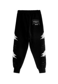 Pantalones deportivos negros con patrones abstractos blancos en los lados, cinturilla elástica y un bolsillo trasero con un detalle de diseño de cassette.