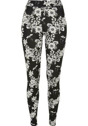 Sorte leggings med et hvidt blomstermønster, lavet af elastisk stof, med en høj talje for ekstra komfort og pasform.