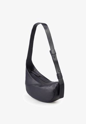 Black leather shoulder bag with a curved shape, smooth texture, adjustable strap, and a zippered compartment on the front.