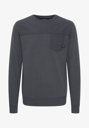 Felpa grigia scura realizzata in tessuto morbido, con un design delle spalle curvato, una tasca a toppa e collo rotondo. Decorata con un marchio discreto.