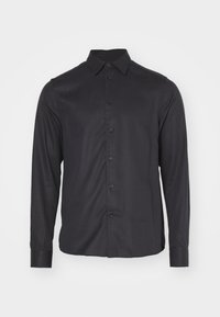 Camicia nera a maniche lunghe realizzata in un tessuto liscio, con colletto a punta, chiusura frontale con bottoni e polsini abbottonati. Branding discreto vicino all'orlo.