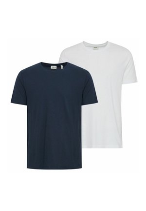Two plain crew neck short-sleeve t-shirts, one navy blue in front and one white behind it, displayed on a white background.