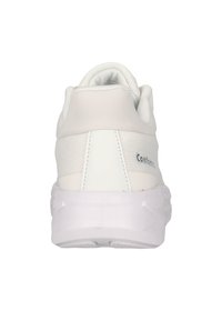 White athletic shoe with a textured mesh upper, padded collar, and a thick, cushioned white sole. Features a logo on the heel.