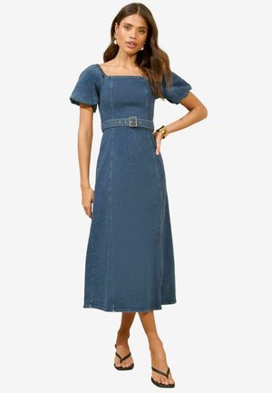 Tumed denimkleit ruudukujulise kaelusega, puffvoodriga varrukatega, vöökoht ja maani siluett tumedas sinises, sisaldab peent õmbluse detaili.