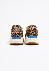 Leopard print sneakers with a textured upper, beige midsole, and blue branding detail on the heel. Chunky, cushioned sole design.