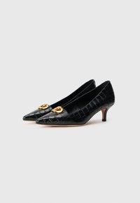 Black patent leather pumps with a crocodile texture, pointed toe, and gold-tone accent hardware. Features a small heel for added comfort.