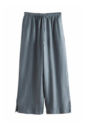 Light blue, wrinkled wide-leg pants with an elastic waistband and adjustable drawstring, featuring side slits for added movement.