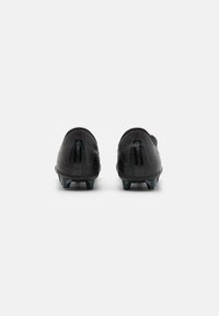 Black soccer cleats with a textured synthetic upper, featuring a sleek design and low profile, complemented by dark plastic studs.