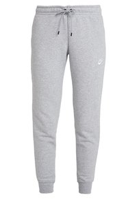 Pantalones de chándal de algodón gris con cintura ajustable por cordón, piernas ajustadas y puños acanalados. Presenta un pequeño logotipo blanco en el muslo izquierdo.