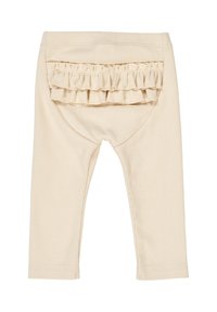 Leggings beige a coste con tasca posteriore arricciata e vita elasticizzata, caratterizzati da una texture liscia e un design aderente.