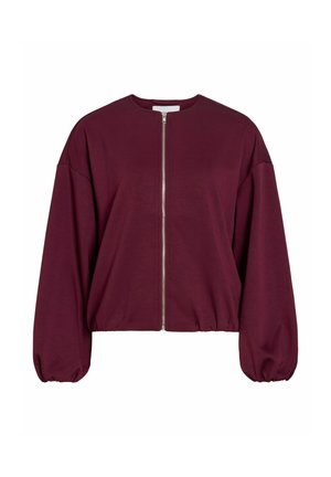 Bordo toonitud lukuga jakk ümmarguse kaeluse, üle suurte varrukate ja kokkutõmmatud alläärega. Valmistatud pehmest ja siledakoelisest kangast. Hõbedane luku detail.