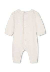 Romper suit bianco lavorato a maglia con maniche lunghe, chiusura frontale con bottoni e motivi in pizzo decorativi sulle spalle. Texture morbida e polsini aderenti.