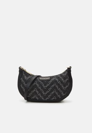 Black fabric shoulder bag with curved shape, featuring repeating "Valentino" logo pattern, gold hardware, and a detachable strap.