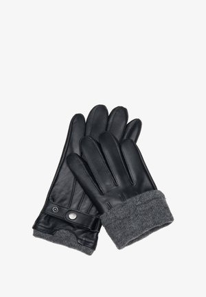 Zwarte leren handschoenen met grijze gebreide manchetten, voorzien van een drukknoopsluiting en gestikte details op de handpalm en vingers. Over het geheel een gladde textuur.