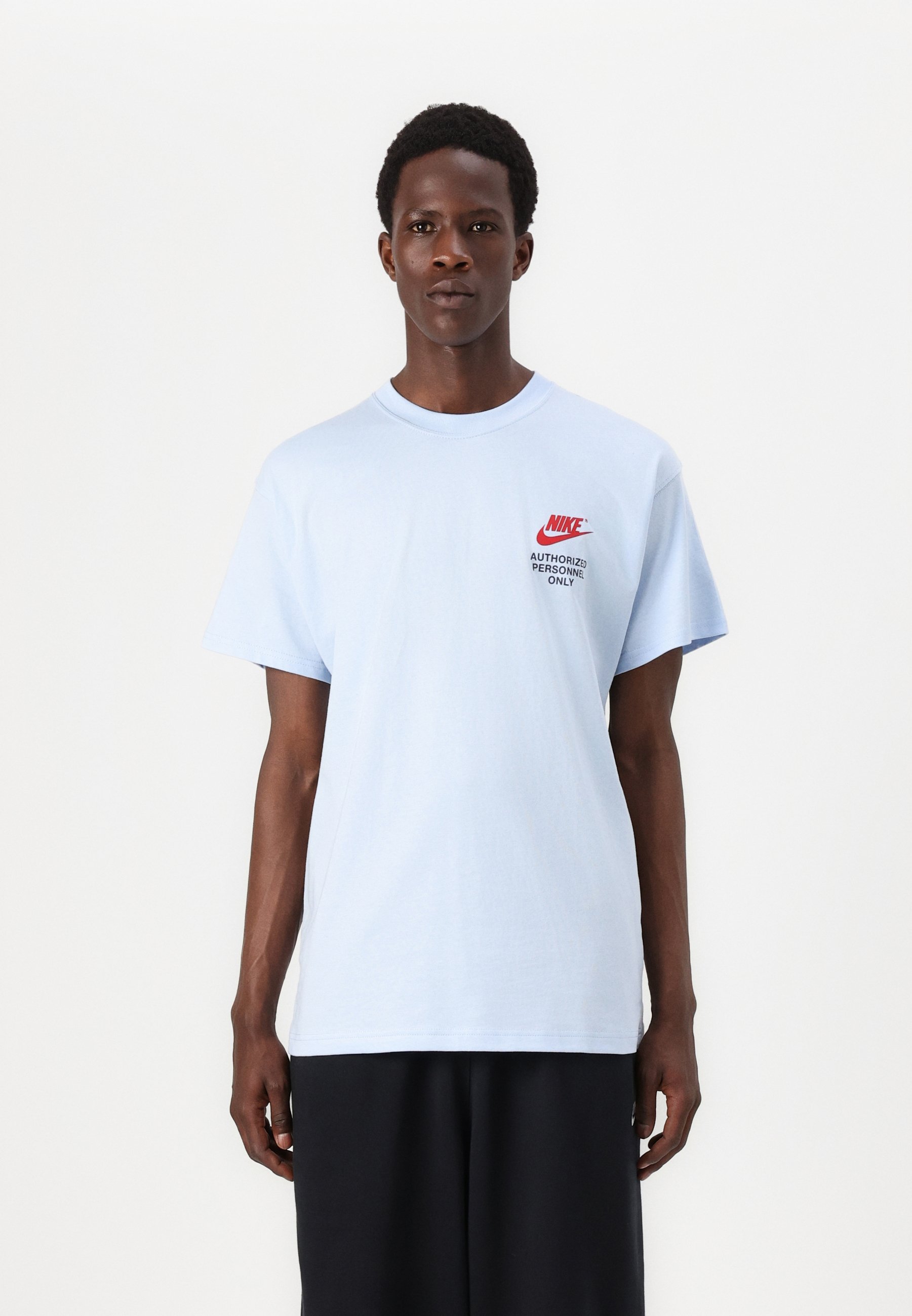 red blue and white nike shirt