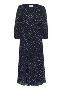 Robe bleu marine à manches longues avec un décolleté en V, ornée de pois blancs, une taille cintrée et un tissu fluide pour un ajustement décontracté.