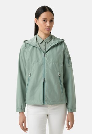Hellgrüne Jacke mit Kapuze, Reißverschluss vorne und zwei seitlichen Taschen. Verfügt über elastische Bündchen und eine Reißverschlusstasche auf der Brust. Glatte Textur.