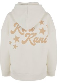 Cream hoodie made of soft fabric with a large beige graphic reading "Kani" and star accents. Features a drawstring hood and ribbed cuffs.