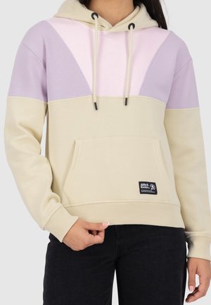 Cream hoodie with light purple and pink triangular color blocks, adjustable drawstring, front pocket, and black logo patch on lower hem.