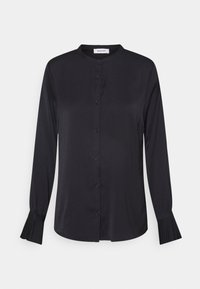 Sort langærmet skjorte med knapfront, rund halsudskæring og plisserede manchetter. Fremstillet af glat, letvægtsstof.