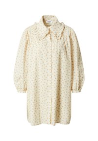 Krämfärgad klänning med en stor, volangkrage, knappstängning och långa, puffiga ärmar. Har ett blommönster i ljus orange.