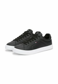 Black leather sneakers with white rubber sole, featuring lace-up design, rounded toe, and subtle logo detail on the tongue and side.