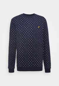 Felpa della marina con motivo a quadrati e pois in tutta la superficie. Collo e polsini a costine. Presenta un piccolo logo giallo sul petto.