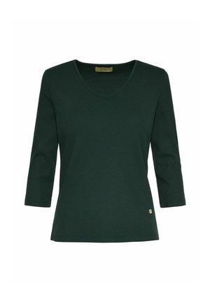 Ciemnozielona bluzka z długim rękawem, z dekoltem w serek i ryżowym wytłoczeniem. Posiada małą metkę z logo w dolnym lewym rogu.