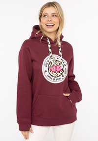 Bordowy hoodie z kieszenią z przodu, sznurkami w leopardzie wzory i grafiką z sercami oraz tekstem w okrągłym wzorze.