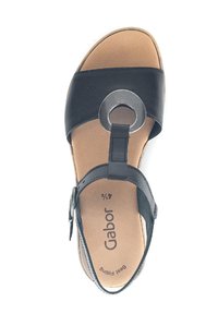 Black leather sandal featuring a circular metal accent, adjustable ankle strap, brown insole with "Gabor" branding, and cushioned footbed.