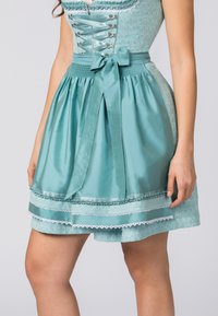 Teal dirndl dress with a fitted floral bodice, satin waistband, and pleated skirt. Features lace trim and decorative ribbon accents.