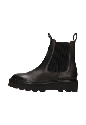 Bottines Chelsea en cuir noir avec semelle épaisse, panneaux élastiques sur les côtés et languettes à l'avant et à l'arrière.