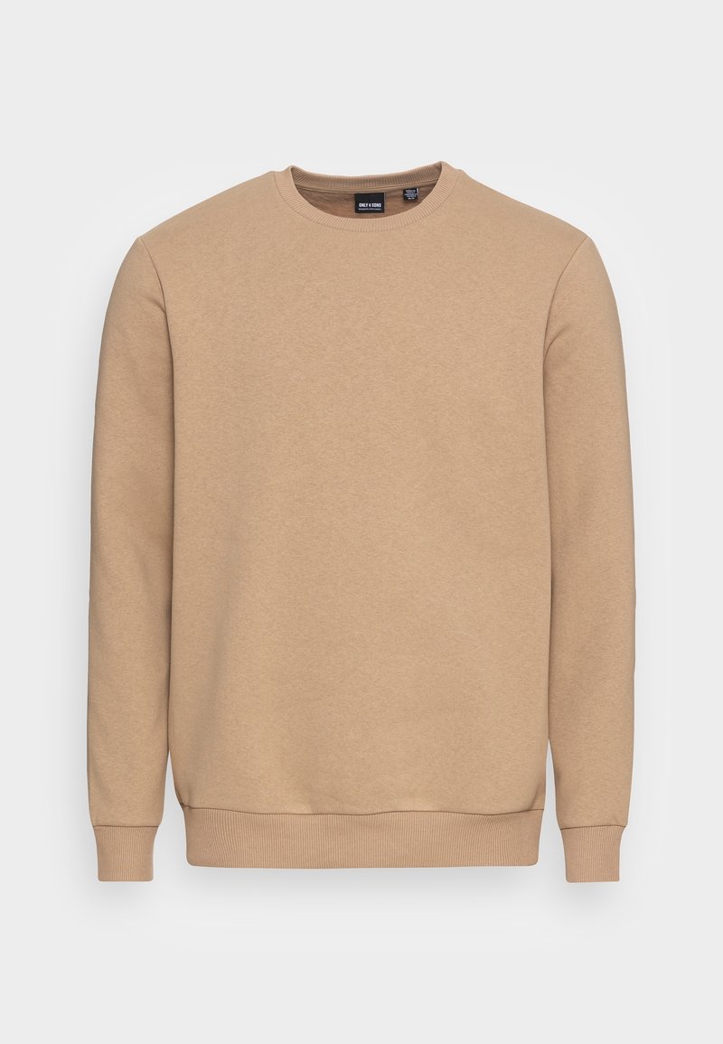 Sweat-shirt beige uni à col rond avec manches longues et poignets et ourlet côtelés sur fond blanc.