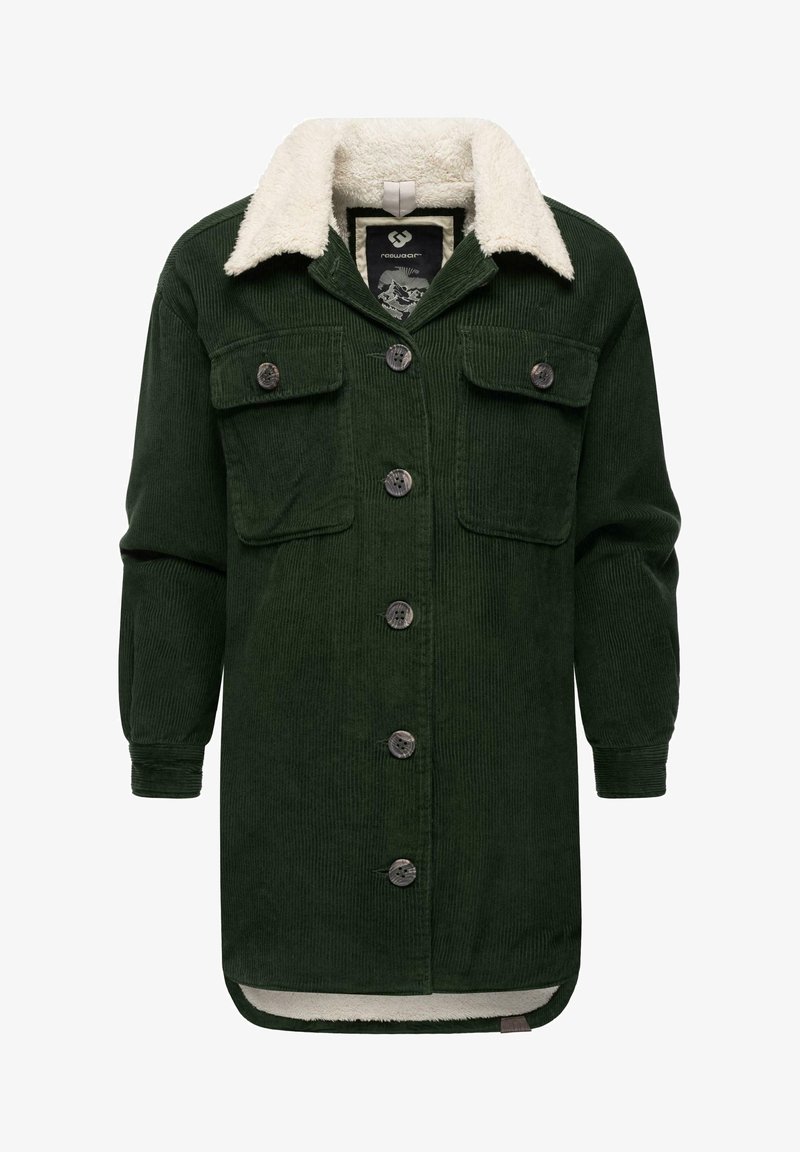 Tumši zaļš korduroja mētelis ar mīkstu krēmkrāsas šerpa apkakli, priekšējiem pogām un divām krūšu kabatām. Garas piedurknes ar ribotām aprocēm.