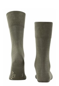Calze in cotone verde oliva con polsini a costine, texture liscia e branding sottile sulle suole. Lunghezza classica da crew con tallone e punta rinforzati.