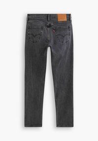 Jeans grigi scuri con una vestibilità slim, realizzati in denim, con un'etichetta in pelle sul retro, due tasche posteriori e dettagli di cucitura visibili.