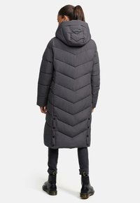 Long gray puffer coat with a chevron quilted design, a hood, and button closures. Textured fabric with a soft finish.