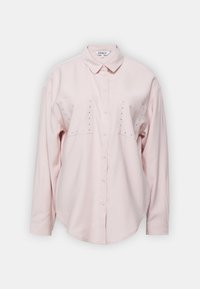 Light pink long-sleeve shirt with a collar, two chest pockets, and decorative studs on the pockets. Soft fabric with a relaxed fit.