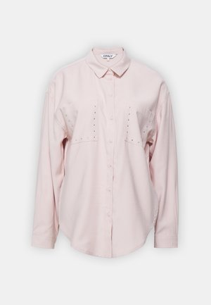 Light pink long-sleeve shirt with a collar, two chest pockets, and decorative studs on the pockets. Soft fabric with a relaxed fit.