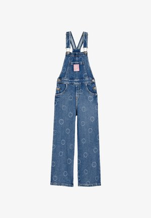 Šviesiai mėlynos džinsinio audinio pervažos su apvaliu raštu, reguliuojamomis petnešomis ir kišenių detalėmis. Laisvas siluetas su tiesiomis kelnėmis.