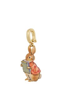 Gold-tone rabbit charm holding a book, detailed with orange clothing and pastel colors. Sculpted with a textured finish, whimsical design.