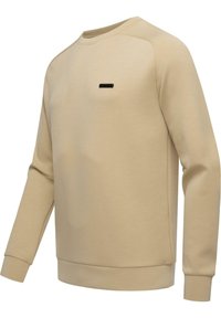 Felpa beige realizzata in tessuto morbido, con maniche lunghe, colletto rotondo e un piccolo logo nero sul petto. Texture liscia.