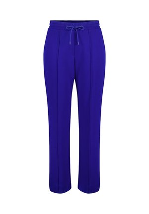 Paarse sweatpants met een elastische tailleband en een trekkoord. Heeft twee voornaadsteken die over elk been lopen. Zachte, gladde stoftextuur.