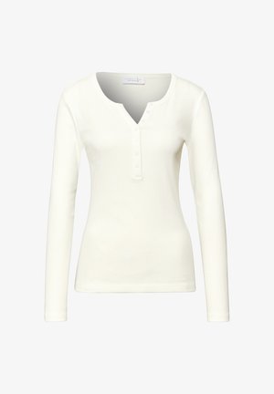 White long-sleeve henley top with a scoop neckline, ribbed texture, and five button placket. Smooth fabric, fitted silhouette.